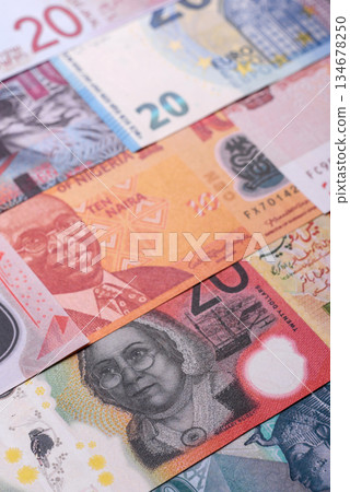 Paper money, banknotes of different countries as a business background. Paper money and cash 134678250
