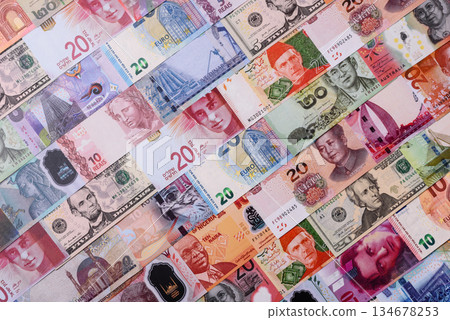 Paper money, banknotes of different countries as a business background. Paper money and cash Paper money, banknotes of different countries as a business background. Paper money and cash 134678253