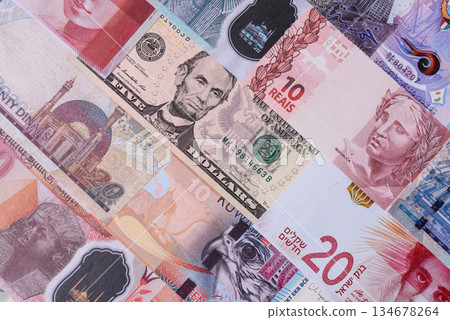 Paper money, banknotes of different countries as a business background. Paper money and cash Paper money, banknotes of different countries as a business background. Paper money and cash 134678264