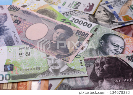 Paper money, banknotes of different countries as a business background. Paper money and cash Paper money, banknotes of different countries as a business background. Paper money and cash 134678283
