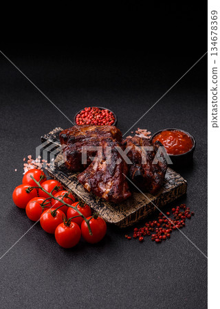 Grilled or barbecued pork ribs with sauce. Grilled ribs 134678369