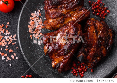 Grilled or barbecued pork ribs with sauce. Grilled ribs 134678379