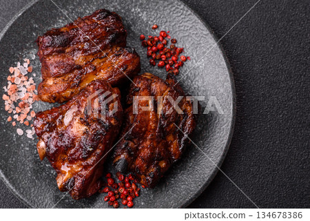 Grilled or barbecued pork ribs with sauce. Grilled ribs Grilled or barbecued pork ribs with sauce. Grilled ribs 134678386