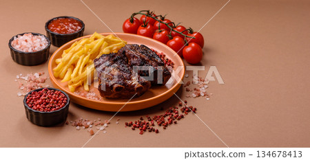 Grilled or barbecued pork ribs with sauce. Grilled ribs Grilled or barbecued pork ribs with sauce. Grilled ribs 134678413