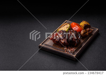 Grilled or barbecued pork ribs with sauce. Grilled ribs Grilled or barbecued pork ribs with sauce. Grilled ribs 134678417