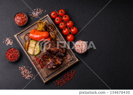 Grilled or barbecued pork ribs with sauce. Grilled ribs Grilled or barbecued pork ribs with sauce. Grilled ribs 134678430