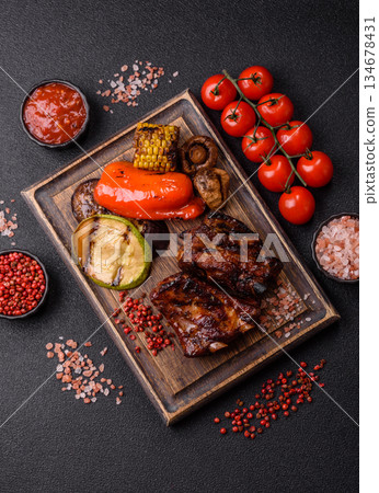 Grilled or barbecued pork ribs with sauce. Grilled ribs Grilled or barbecued pork ribs with sauce. Grilled ribs 134678431