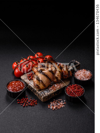 Chicken breast cooked on a grill or barbecue with sauce. Grilled chicken Chicken breast cooked on a grill or barbecue with sauce. Grilled chicken 134678436