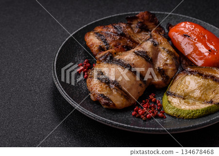Chicken breast cooked on a grill or barbecue with sauce. Grilled chicken Chicken breast cooked on a grill or barbecue with sauce. Grilled chicken 134678468