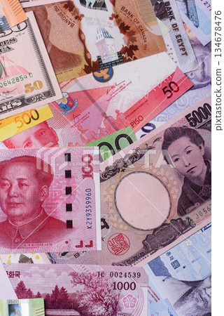 Paper money, banknotes of different countries as a business background. Paper money and cash Paper money, banknotes of different countries as a business background. Paper money and cash 134678476