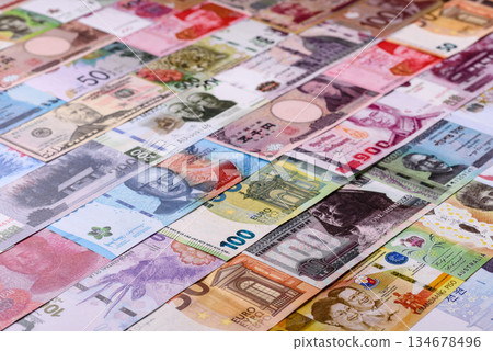 Paper money, banknotes of different countries as a business background. Paper money and cash Paper money, banknotes of different countries as a business background. Paper money and cash 134678496