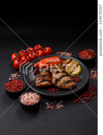 Chicken breast cooked on a grill or barbecue with sauce. Grilled chicken Chicken breast cooked on a grill or barbecue with sauce. Grilled chicken 134678507