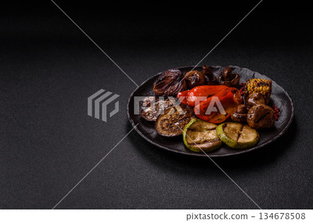 Grilled vegetables, bell peppers, mushrooms, and zucchini, a vegetarian meal. Grilled vegetables Grilled vegetables, bell peppers, mushrooms, and zucchini, a vegetarian meal. Grilled vegetables 134678508