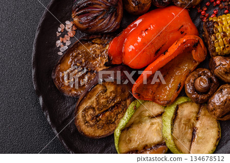 Grilled vegetables, bell peppers, mushrooms, and zucchini, a vegetarian meal. Grilled vegetables Grilled vegetables, bell peppers, mushrooms, and zucchini, a vegetarian meal. Grilled vegetables 134678512