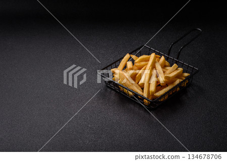 French fries are salty, crispy, and fried in oil, unhealthy takeaway food. French fries French fries are salty, crispy, and fried in oil, unhealthy takeaway food. French fries 134678706