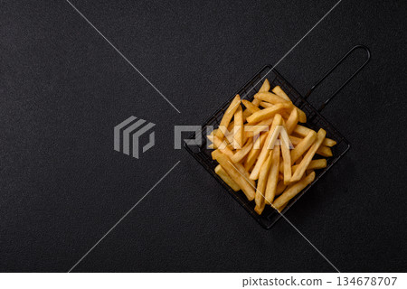 French fries are salty, crispy, and fried in oil, unhealthy takeaway food. French fries French fries are salty, crispy, and fried in oil, unhealthy takeaway food. French fries 134678707