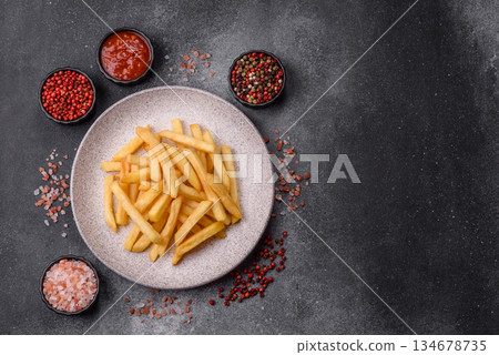 French fries are salty, crispy, and fried in oil, unhealthy takeaway food. French fries French fries are salty, crispy, and fried in oil, unhealthy takeaway food. French fries 134678735