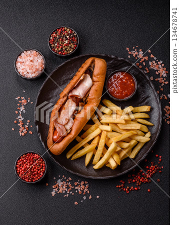 French fries are salty, crispy, and fried in oil, unhealthy takeaway food. French fries 134678741