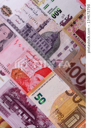 Paper money, banknotes of different countries as a business background. Paper money and cash Paper money, banknotes of different countries as a business background. Paper money and cash 134678798