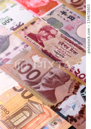 Paper money, banknotes of different countries as a business background. Paper money and cash 134678803