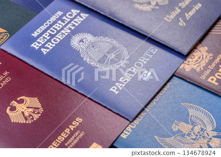 A background of several passports from different countries, an international ID card. Passport A background of several passports from different countries, an international ID card. Passport 134678924