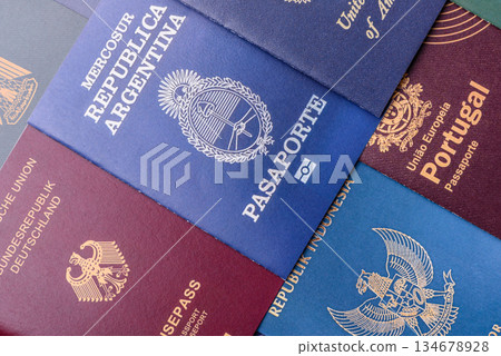 A background of several passports from different countries, an international ID card. Passport A background of several passports from different countries, an international ID card. Passport 134678928