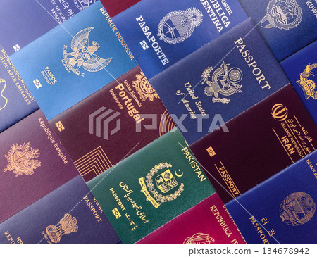 A background of several passports from different countries, an international ID card. Passport A background of several passports from different countries, an international ID card. Passport 134678942