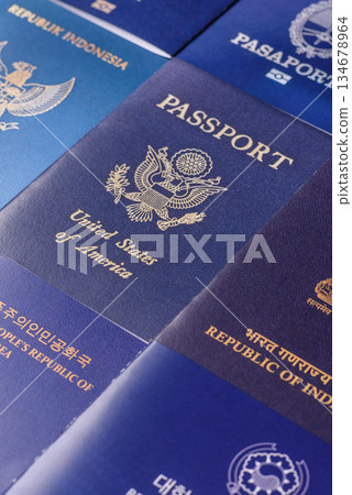 A background of several passports from different countries, an international ID card. Passport A background of several passports from different countries, an international ID card. Passport 134678964