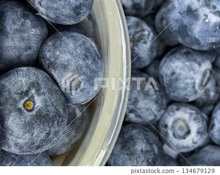 Macro Close-Up of Fresh Blueberries with Natural Frosty Texture Macro Close-Up of Fresh Blueberries with Natural Frosty Texture 134679129