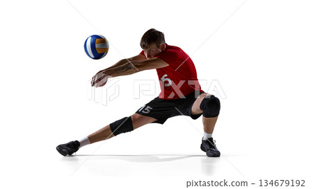 Volleyball player receiving ball kneeling isolated on white. Volleyball player receiving ball kneeling isolated on white. 134679192