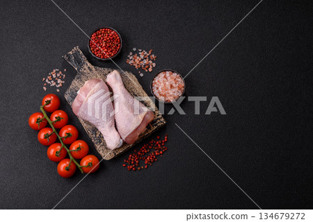 Raw chicken legs, poultry meat on the bone for barbecue. Chicken legs as a food background Raw chicken legs, poultry meat on the bone for barbecue. Chicken legs as a food background 134679272