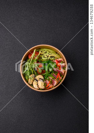 Seared tuna tataki in a bowl with sesame seeds, rice, and vegetables. Tuna tataki Seared tuna tataki in a bowl with sesame seeds, rice, and vegetables. Tuna tataki 134679288