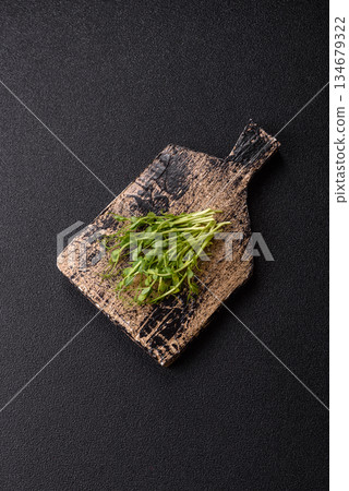Fresh green sprouts of pea microgreens for a healthy detox meal. Sprout pea microgreens Fresh green sprouts of pea microgreens for a healthy detox meal. Sprout pea microgreens 134679322