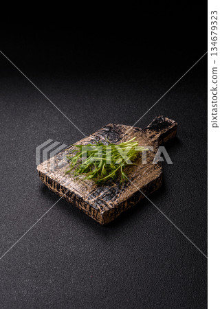 Fresh green sprouts of pea microgreens for a healthy detox meal. Sprout pea microgreens Fresh green sprouts of pea microgreens for a healthy detox meal. Sprout pea microgreens 134679323