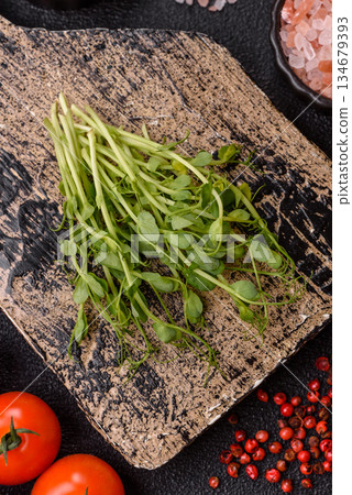 Fresh green sprouts of pea microgreens for a healthy detox meal. Sprout pea microgreens Fresh green sprouts of pea microgreens for a healthy detox meal. Sprout pea microgreens 134679393