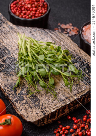 Fresh green sprouts of pea microgreens for a healthy detox meal. Sprout pea microgreens Fresh green sprouts of pea microgreens for a healthy detox meal. Sprout pea microgreens 134679394