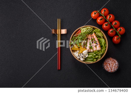 A prawn or shrimp bowl with rice, tomatoes, sauce, and vegetables, Asian food. Prawn or shrimp A prawn or shrimp bowl with rice, tomatoes, sauce, and vegetables, Asian food. Prawn or shrimp 134679400