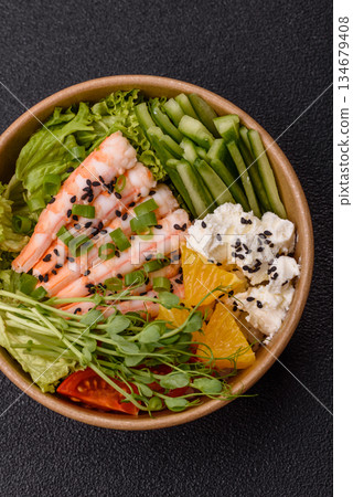 A prawn or shrimp bowl with rice, tomatoes, sauce, and vegetables, Asian food. Prawn or shrimp A prawn or shrimp bowl with rice, tomatoes, sauce, and vegetables, Asian food. Prawn or shrimp 134679408