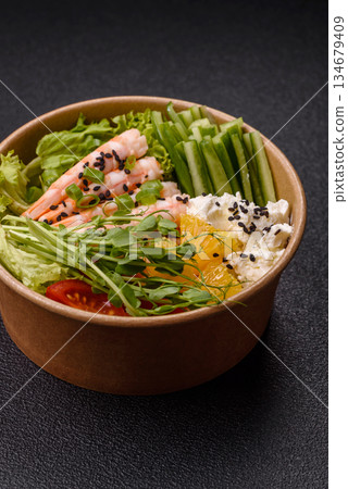 A prawn or shrimp bowl with rice, tomatoes, sauce, and vegetables, Asian food. Prawn or shrimp A prawn or shrimp bowl with rice, tomatoes, sauce, and vegetables, Asian food. Prawn or shrimp 134679409