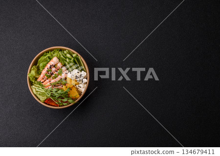 A prawn or shrimp bowl with rice, tomatoes, sauce, and vegetables, Asian food. Prawn or shrimp 134679411