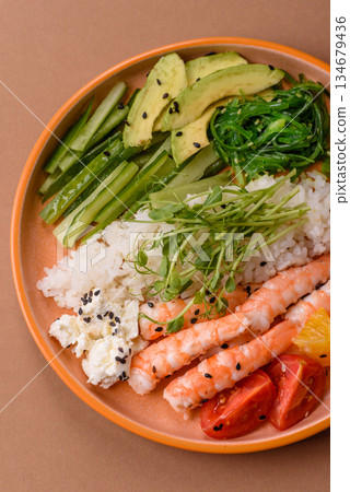 A prawn or shrimp bowl with rice, tomatoes, sauce, and vegetables, Asian food. Prawn or shrimp A prawn or shrimp bowl with rice, tomatoes, sauce, and vegetables, Asian food. Prawn or shrimp 134679436