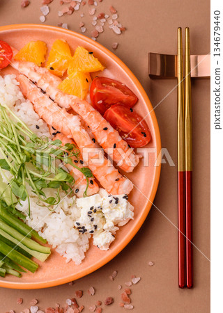 A prawn or shrimp bowl with rice, tomatoes, sauce, and vegetables, Asian food. Prawn or shrimp 134679440