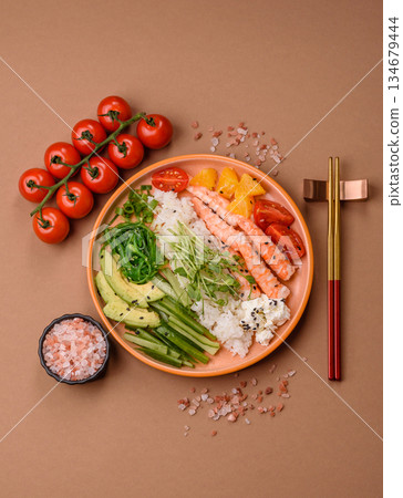 A prawn or shrimp bowl with rice, tomatoes, sauce, and vegetables, Asian food. Prawn or shrimp 134679444