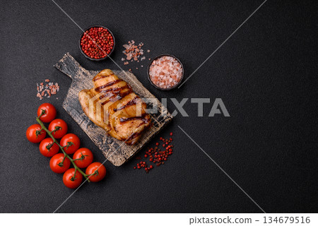 Grilled boneless chicken legs baked on the barbecue for lunch. Grilled chicken as a background Grilled boneless chicken legs baked on the barbecue for lunch. Grilled chicken as a background 134679516