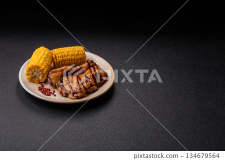Grilled boneless chicken legs baked on the barbecue for lunch. Grilled chicken as a background Grilled boneless chicken legs baked on the barbecue for lunch. Grilled chicken as a background 134679564