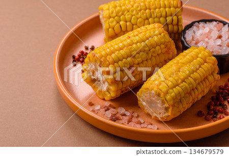 Corn cob cooked in chunks, vegetables, healthy vegetarian food. Boiled corn as a background Corn cob cooked in chunks, vegetables, healthy vegetarian food. Boiled corn as a background 134679579