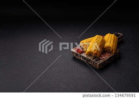 Corn cob cooked in chunks, vegetables, healthy vegetarian food. Boiled corn as a background Corn cob cooked in chunks, vegetables, healthy vegetarian food. Boiled corn as a background 134679591