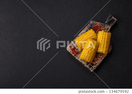 Corn cob cooked in chunks, vegetables, healthy vegetarian food. Boiled corn as a background Corn cob cooked in chunks, vegetables, healthy vegetarian food. Boiled corn as a background 134679592