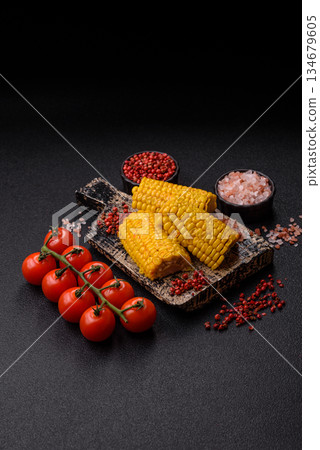 Corn cob cooked in chunks, vegetables, healthy vegetarian food. Boiled corn as a background Corn cob cooked in chunks, vegetables, healthy vegetarian food. Boiled corn as a background 134679605