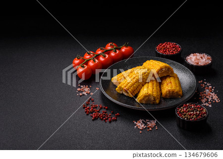 Corn cob cooked in chunks, vegetables, healthy vegetarian food. Boiled corn as a background Corn cob cooked in chunks, vegetables, healthy vegetarian food. Boiled corn as a background 134679606